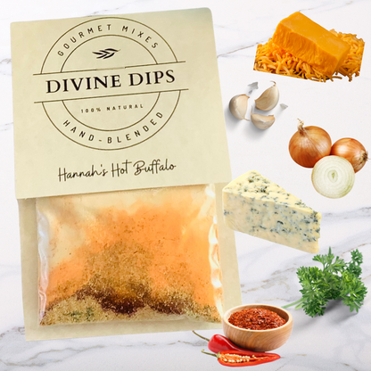 Hannah's hot buffalo seasoning dip mix in package with raw ingredients surrounding cheddar, blue cheese, onion, garlic, parsley, chipotle chili